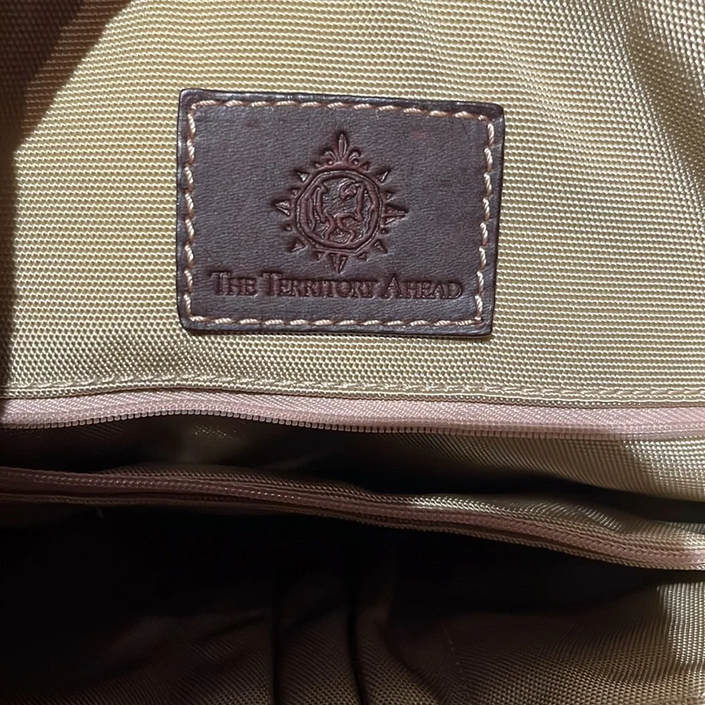The territory ahead, black with brown leather trim, laptop bag